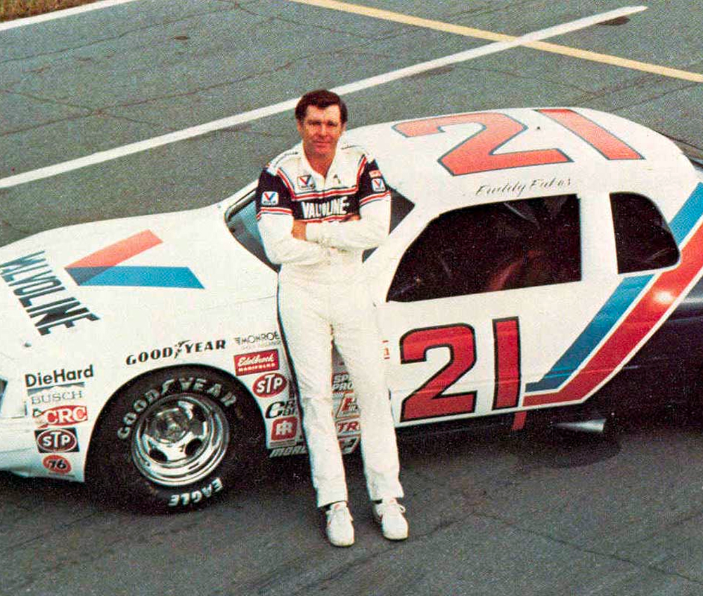 Buddy Baker in front of his race car
